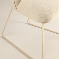 Cream textured fabric chair with light beige metal legs, ideal for a modern minimalist aesthetic.