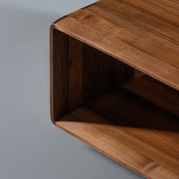 "Rich walnut wood grain with smooth, warm hues; modern minimalist design for home decor."