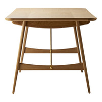 Light oak wood table with smooth finish and minimalistic design, featuring tapered legs and subtle golden accents.