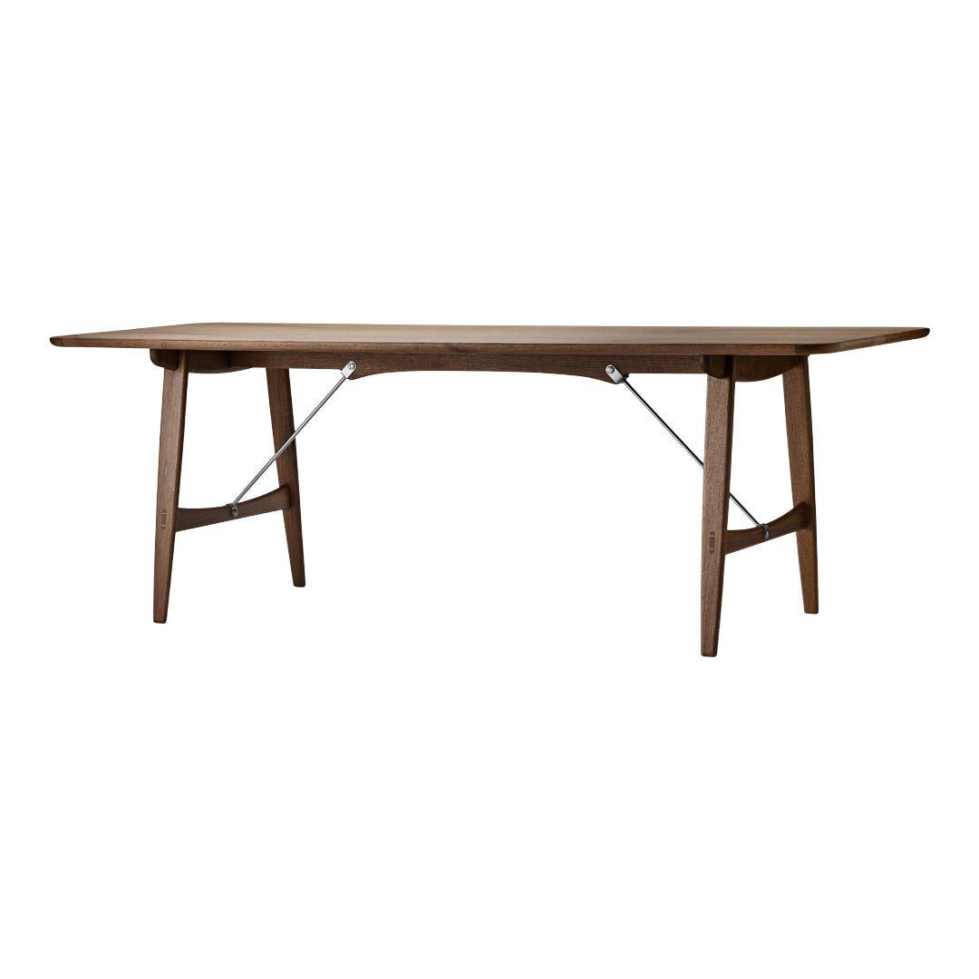Walnut dining table featuring a smooth, warm brown finish with a sleek, simple design and minimalistic detailing.