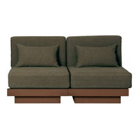 Green upholstered loveseat with two matching cushions, set on a sleek brown wooden base. Modern, minimalist design.