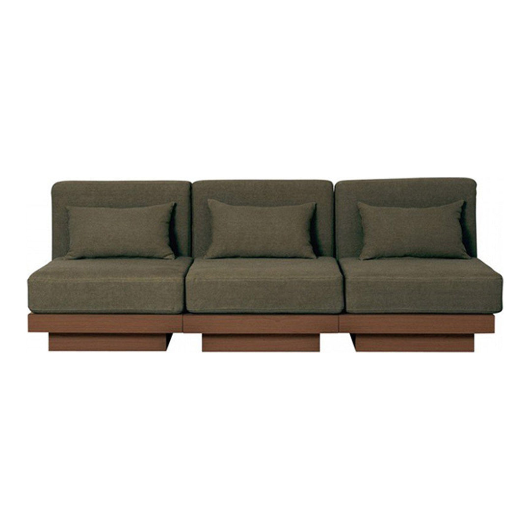 Stylish green fabric sofa with clean lines and seamless brown base, perfect for modern living spaces.