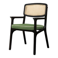 Black chair with a cane backrest and olive green cushion trim, featuring a sophisticated, modern design.