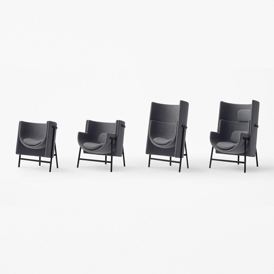 Set of four modern armchairs in sleek black with smooth curved lines and minimalist design. Perfect for contemporary decor.