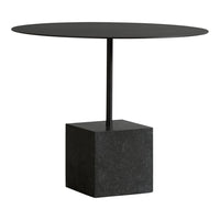 Black round tabletop on a sleek black geometric base, minimalist design perfect for modern interiors.