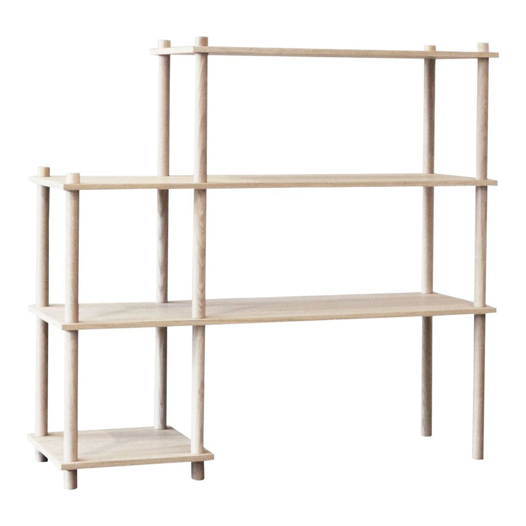Light wood shelving unit with a minimalist design, featuring clean lines and an open structure.