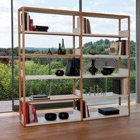 Modern wooden bookshelf with natural oak finish and white shelves, showcasing a minimalist design and stylish decor.