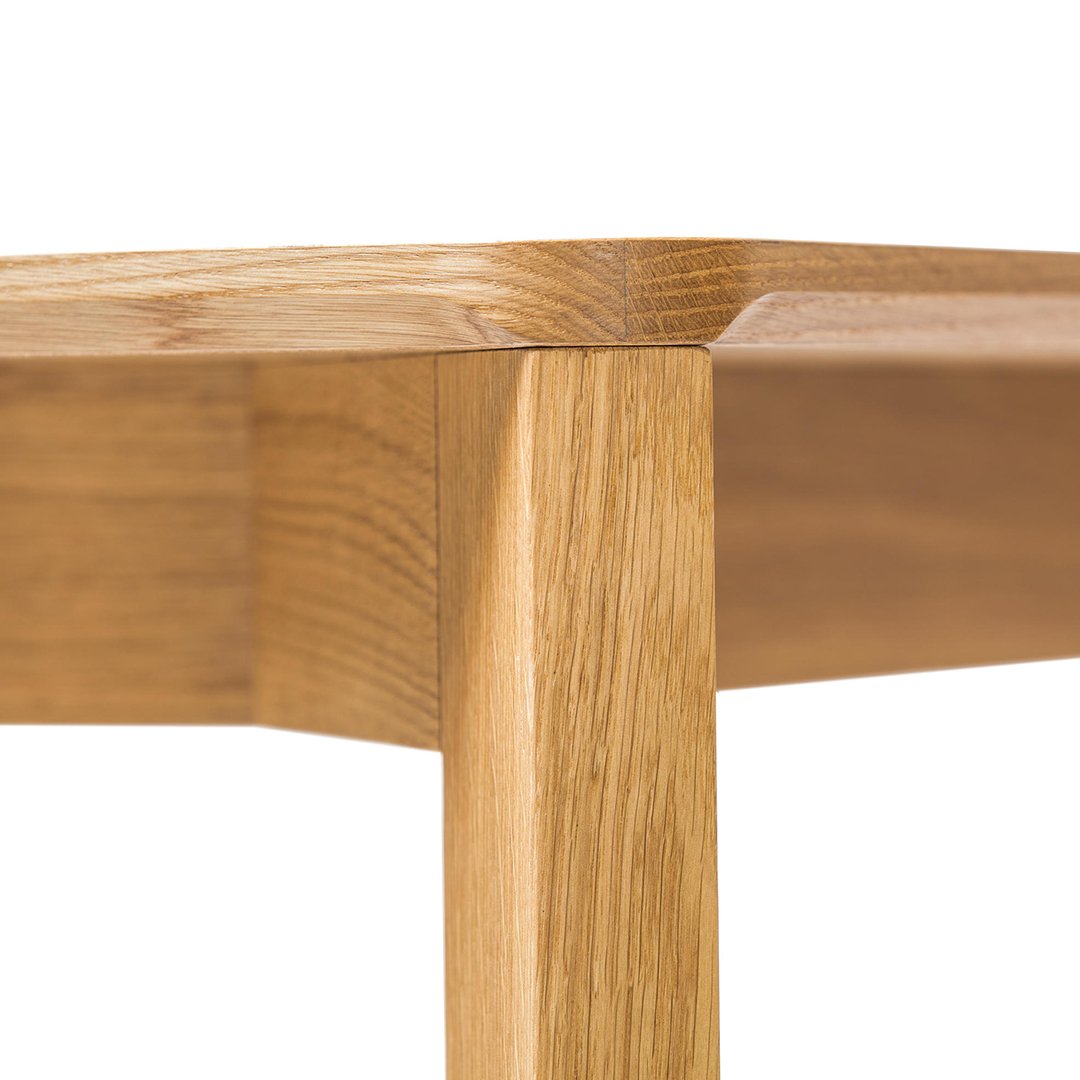 Natural oak wood surface with smooth edges and a warm, light brown hue. Simple, elegant design highlights grain patterns.