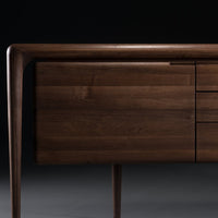 Dark walnut wood sideboard with sleek lines and smooth finish, featuring a minimalist design perfect for modern interiors.