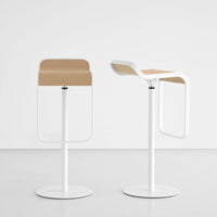 Minimalist white bar stools with natural wood grain seats, featuring smooth lines and a contemporary design.