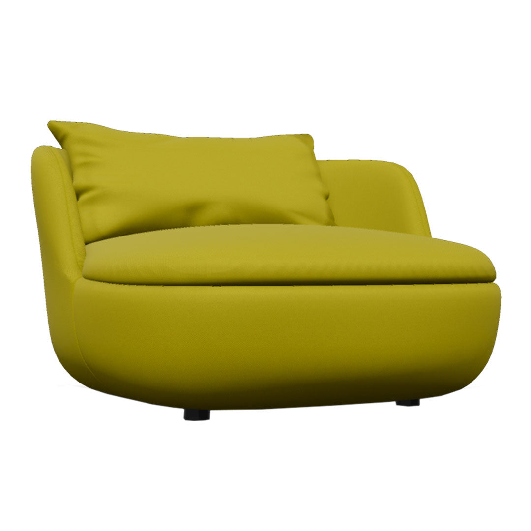 Lime green upholstered lounge chair with a smooth, rounded design and matching pillow. Ideal for modern decor.