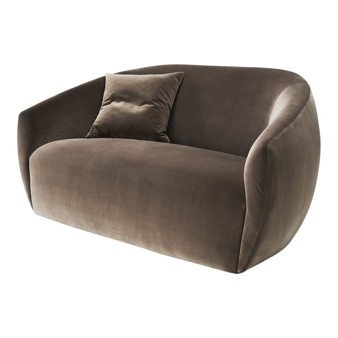 Brown velvet loveseat with smooth, minimalist design and a matching accent pillow for modern decor.