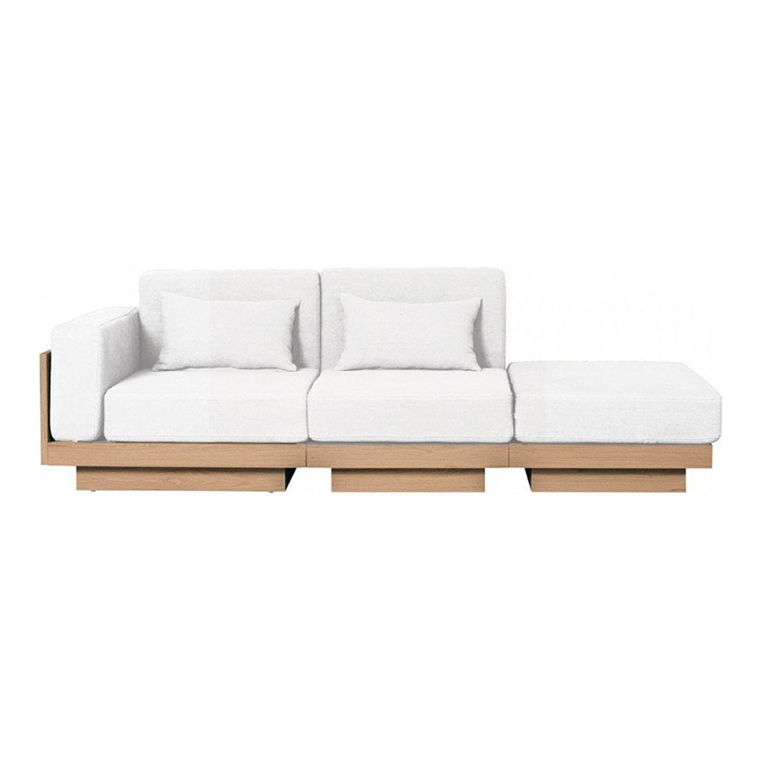 White sectional sofa with clean lines and a minimalist wooden base, perfect for modern decor.