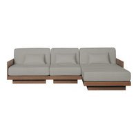 Light gray sofa with a minimalist design, featuring smooth cushions and a warm wood base.