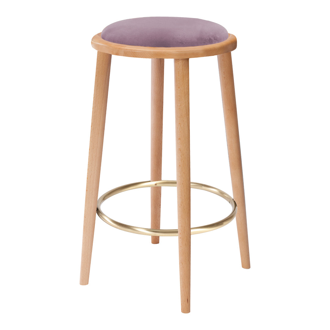 Lavender cushioned stool with natural wooden legs and a metallic gold footrest, featuring a sleek, modern design.