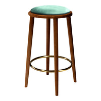 Mint green padded seat with wooden legs and a gold footrest on a classic bar stool. Perfect for modern decor.