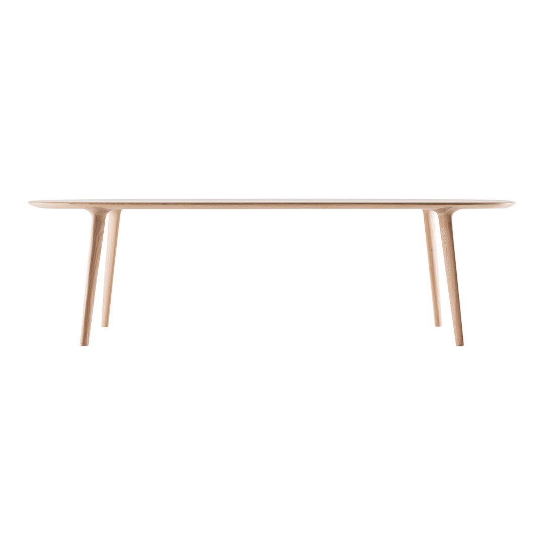 Light wood dining table with a smooth surface and minimalist design, showcasing natural beige tones and clean lines.