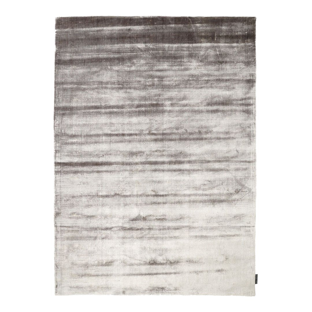 Gray to white gradient area rug with a subtle sheen and textured pattern, perfect for modern decor.