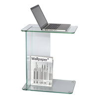Clear glass side table with sleek, modern design. Features minimalist lines and a polished finish for a contemporary look.