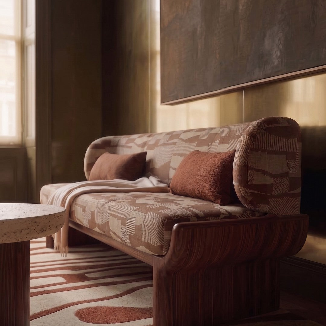 "Modern sofa in earthy tones with abstract patterns, featuring brown and beige accents on a stylish wooden frame."