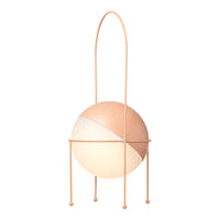 Modern lamp featuring a peach and white split design with a sleek pastel base. Stylish and contemporary home decor.