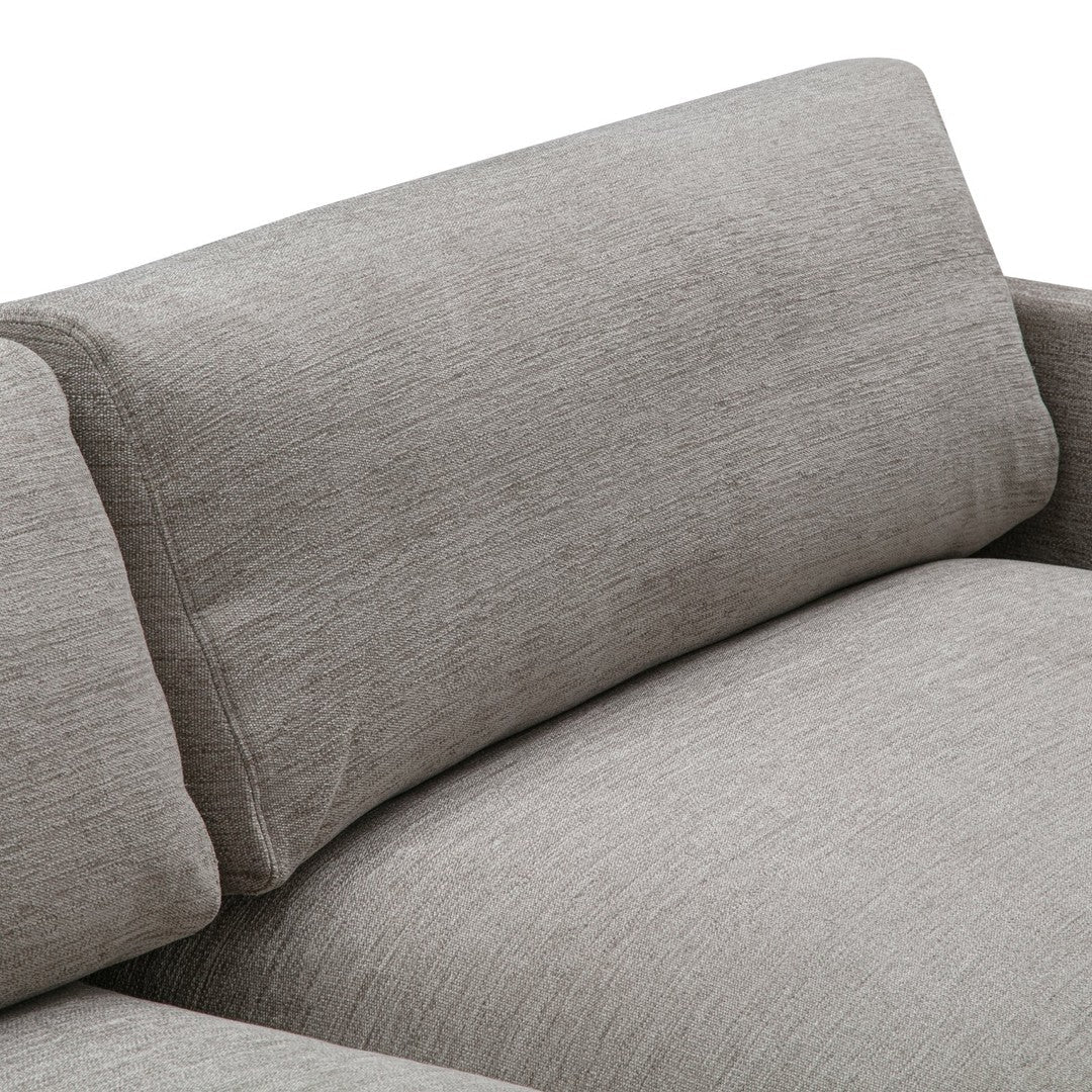 Light gray textured fabric sofa with a subtle, woven pattern and minimalist design, perfect for modern interiors.