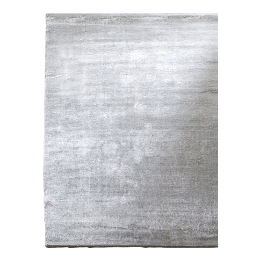 Silver area rug featuring a subtle textured pattern, perfect for modern interiors. Ideal for adding elegance.