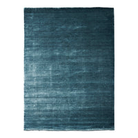 Teal area rug with a textured, gradient pattern, featuring deep blue hues and subtle variations for added depth.