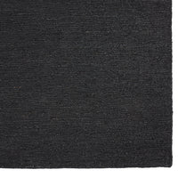Black textured rug with a subtle woven pattern, perfect for modern decor.