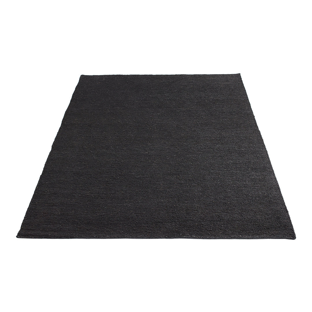 Solid black rectangular rug with a textured woven pattern. Ideal for modern decor and versatile styling.