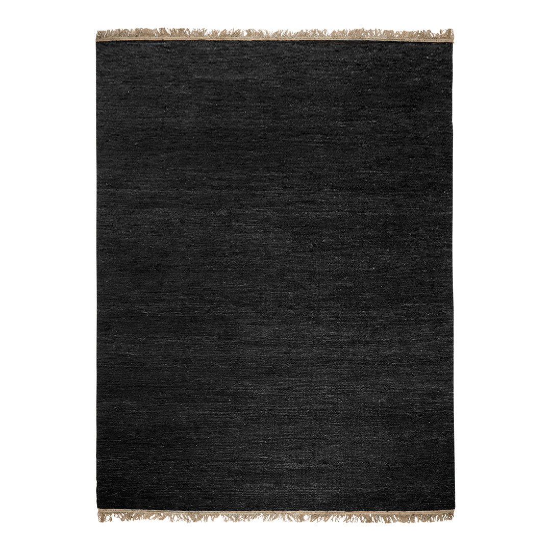 Black textured rug with fringed edges, offering a sleek and modern look for any decor.