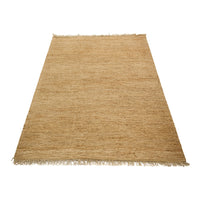 Natural beige woven rug with subtle texture and fringed edges, perfect for adding warmth to any space.