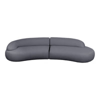 Curved gray sofa with a smooth, minimalist design, perfect for modern living spaces.