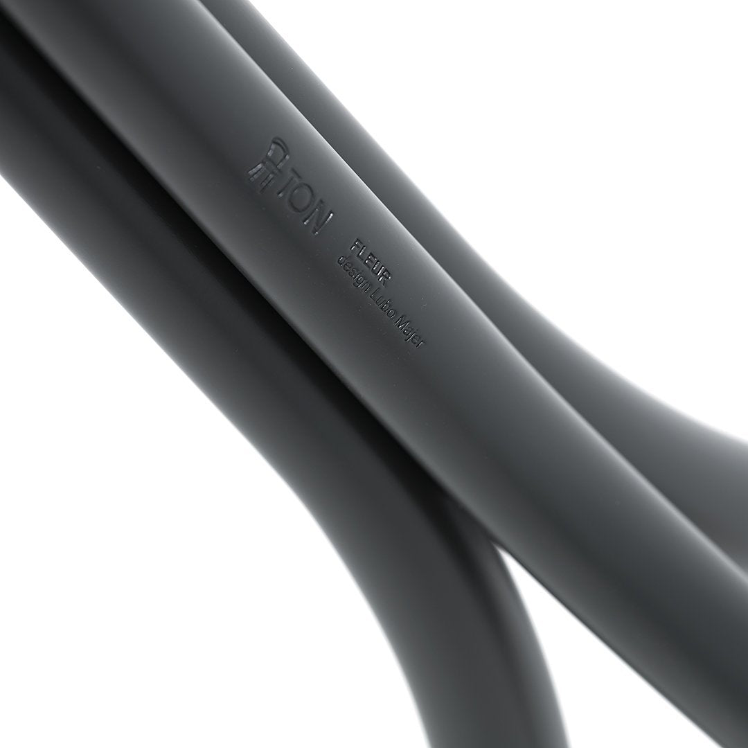 Sleek black curves with a smooth matte finish, showcasing modern design and minimalistic style.