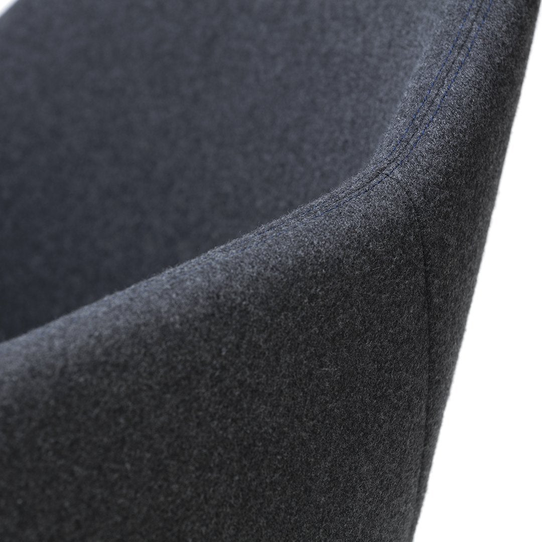Dark gray upholstered chair with a smooth, textured surface and subtle stitching details. Modern and minimalist design.