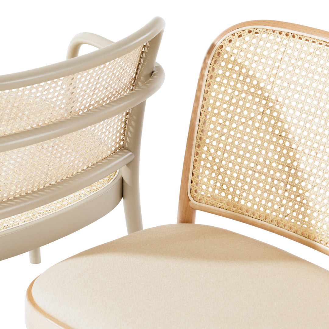 Beige and taupe dining chair with a woven cane backrest and a smooth, padded seat. Elegant and modern design.