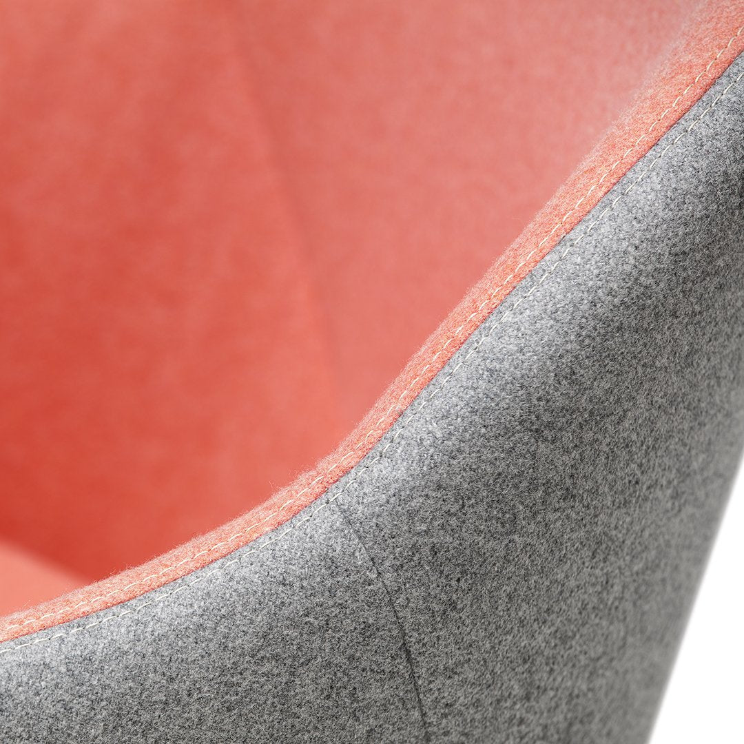 Gray and coral color combination with a smooth felt texture and contrasting seam detail. Perfect for modern decor.