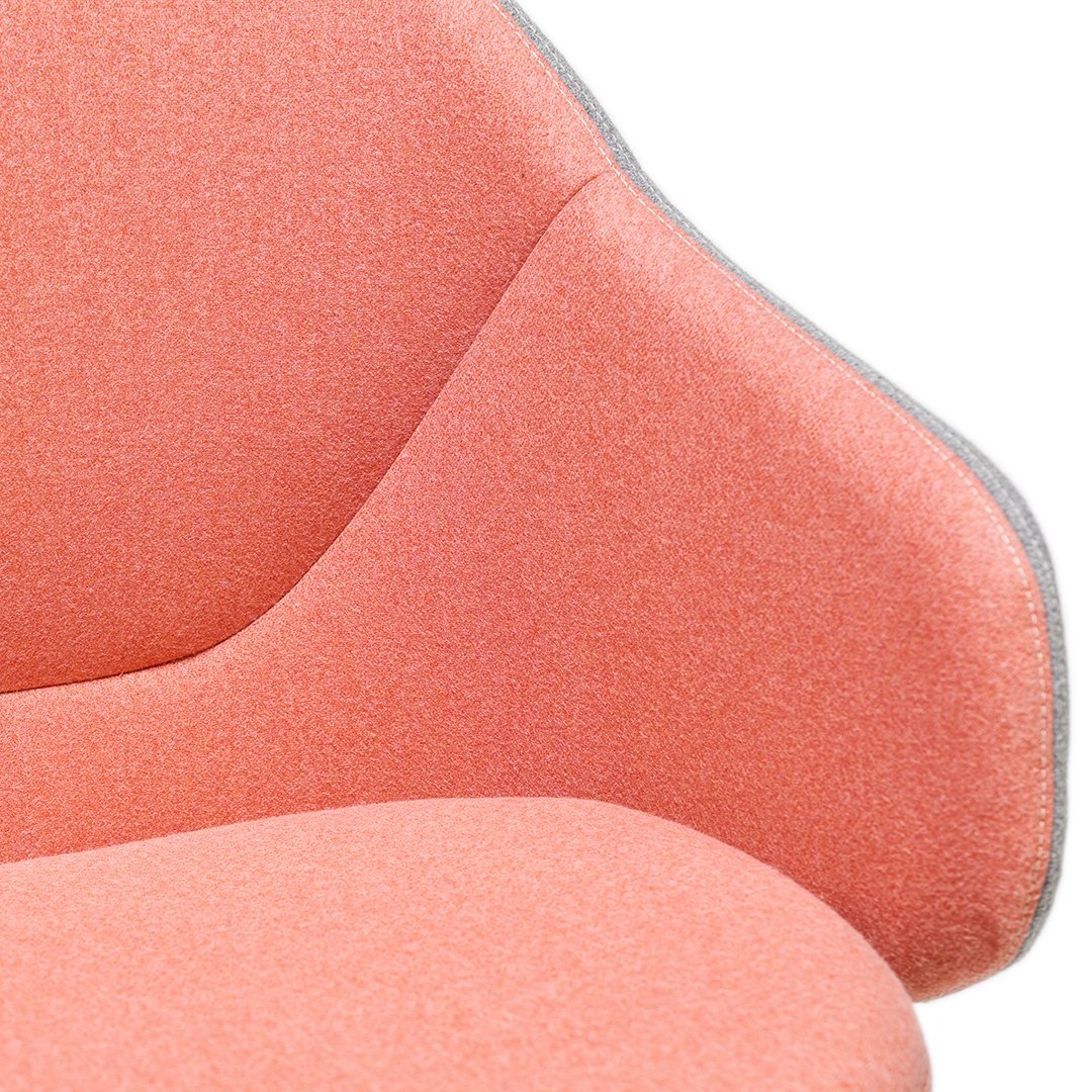 Soft coral fabric with a subtle texture, featuring a gray trim along the edges for a modern touch.