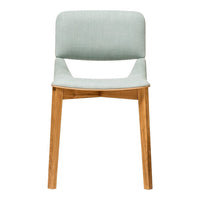 Light blue upholstered chair with natural wood legs, featuring a minimalist design and subtle texture.