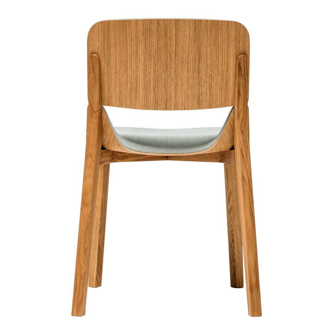 Natural wood tones with a light grey seat create a modern, minimalist chair design. Perfect for contemporary decor.