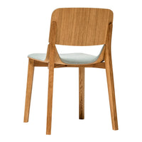 Wooden chair with light oak finish and soft blue cushion, featuring a simple, modern design and smooth lines.
