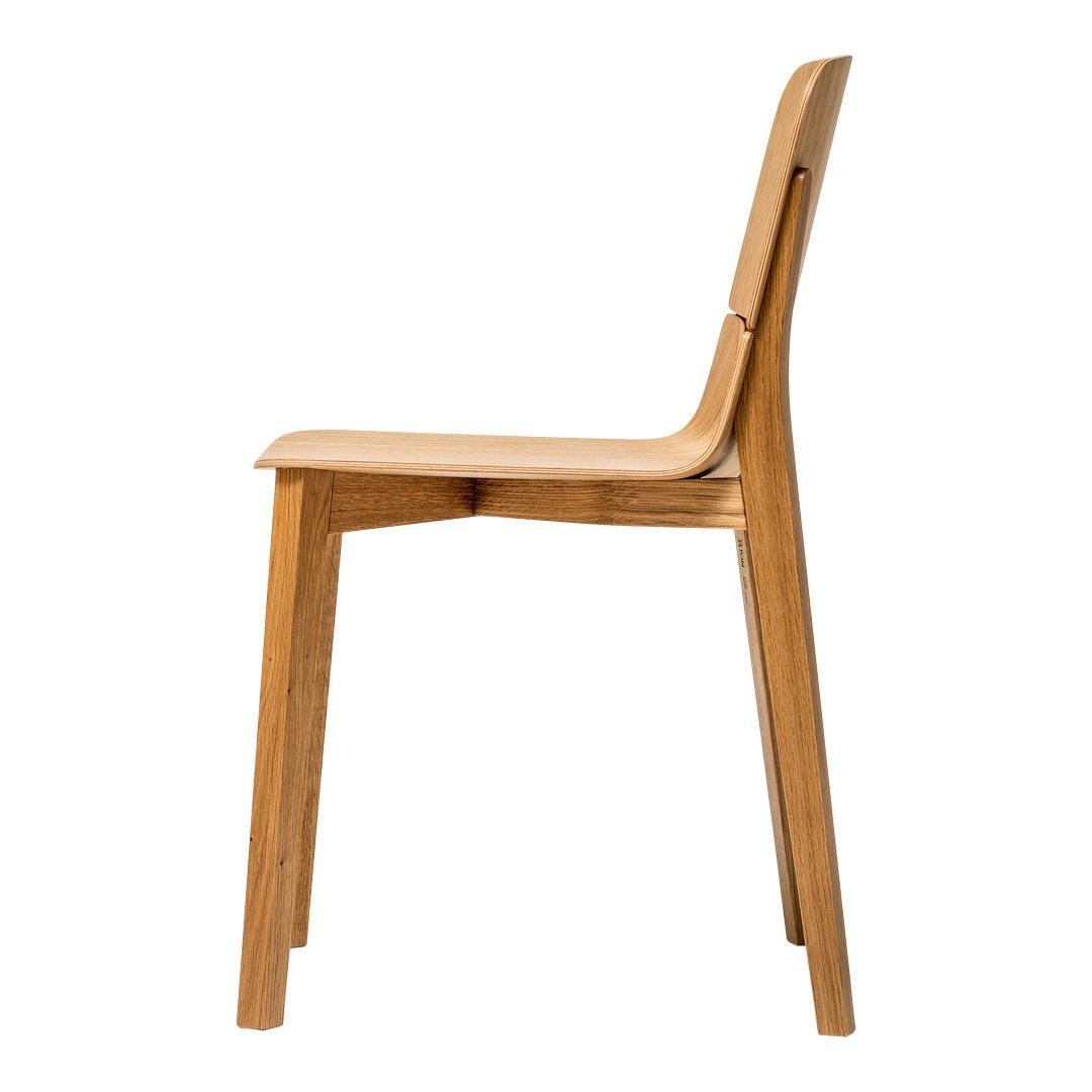 Minimalist wooden chair in natural oak finish with smooth, clean lines and no upholstery.