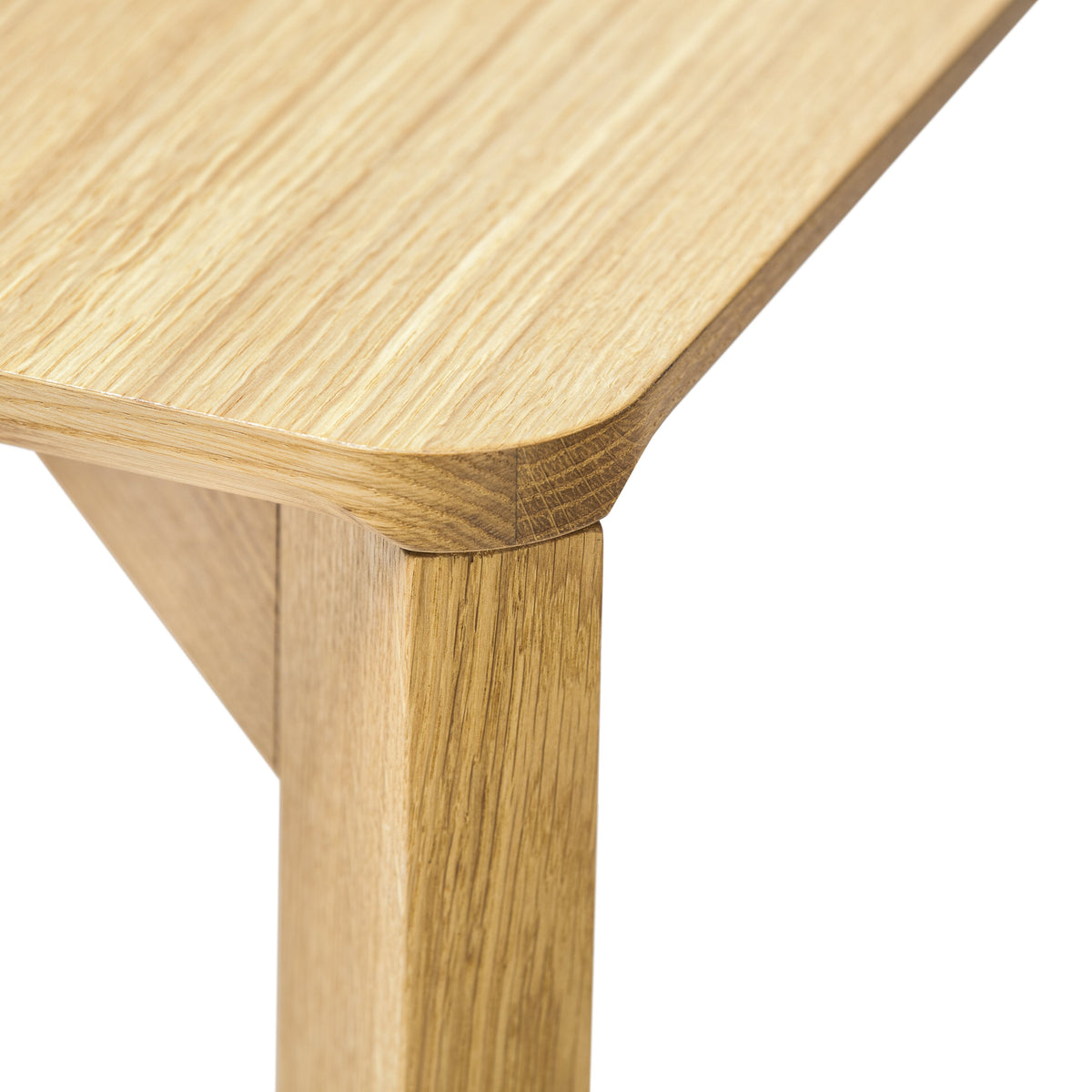 Light natural wood table with a smooth finish, featuring warm golden tones and subtle grain patterns.