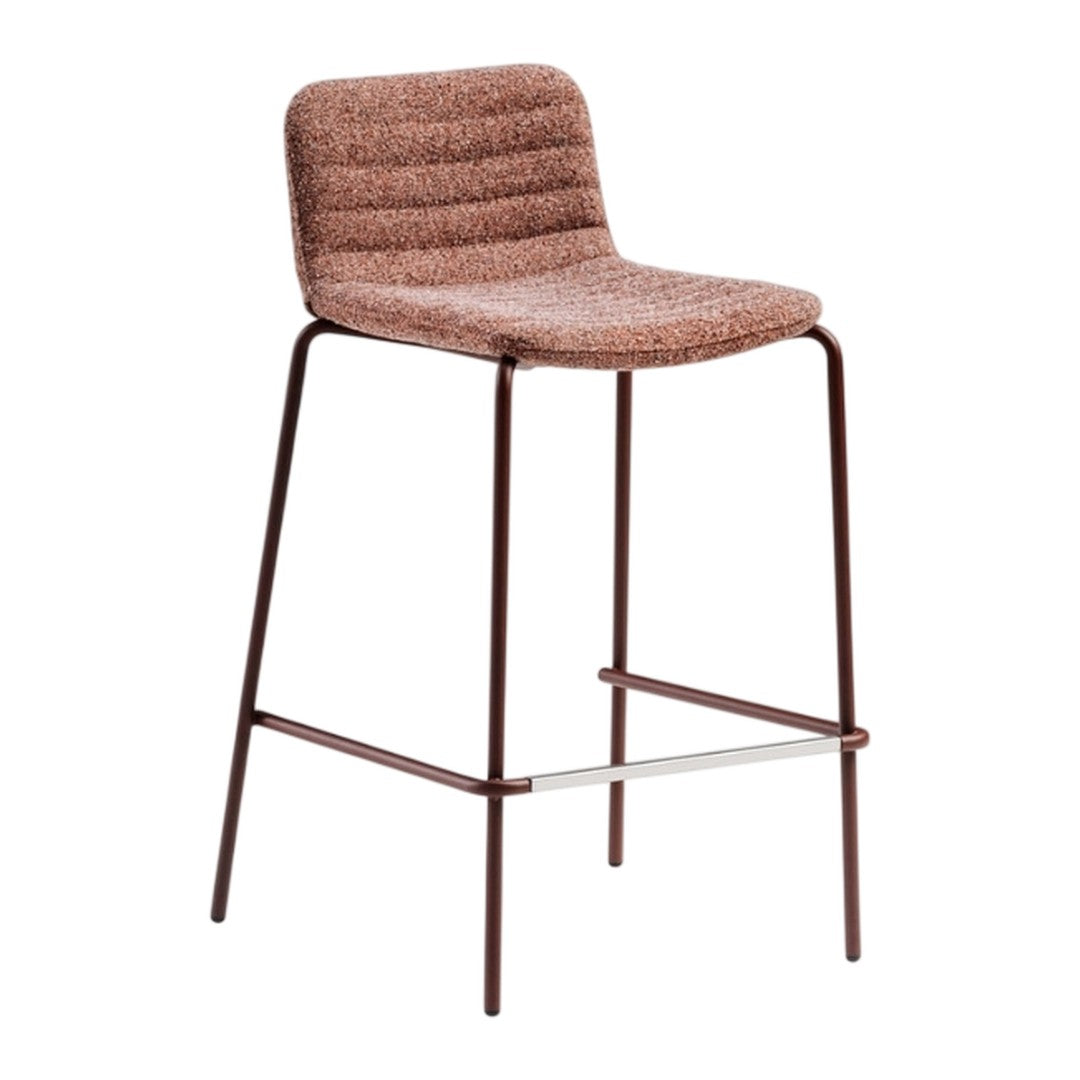 Textured rust-colored bar stool with subtle ribbed pattern and sleek metal frame. Ideal for modern decor.