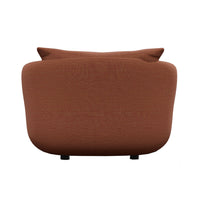 Rust-colored sofa with a smooth texture and minimalist design, featuring subtle curved lines.