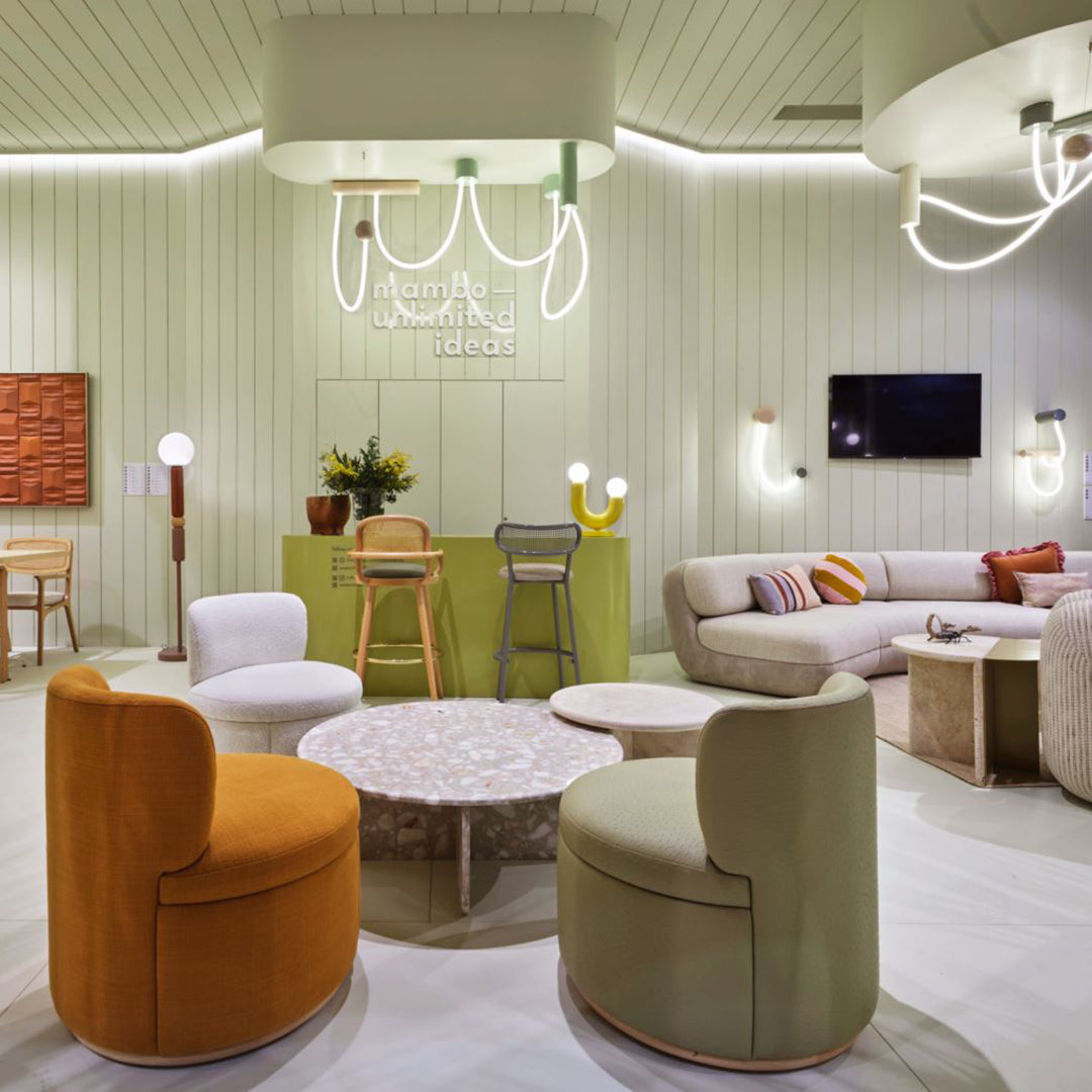 Colorful furniture featuring orange, green, white, beige, and pastel accents in a modern interior setting.