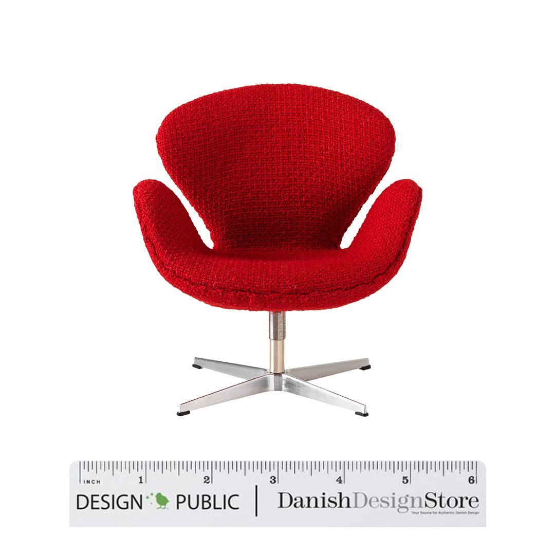 Red upholstered chair with a modern, textured pattern and sleek silver base. Perfect for adding bold color to any space.