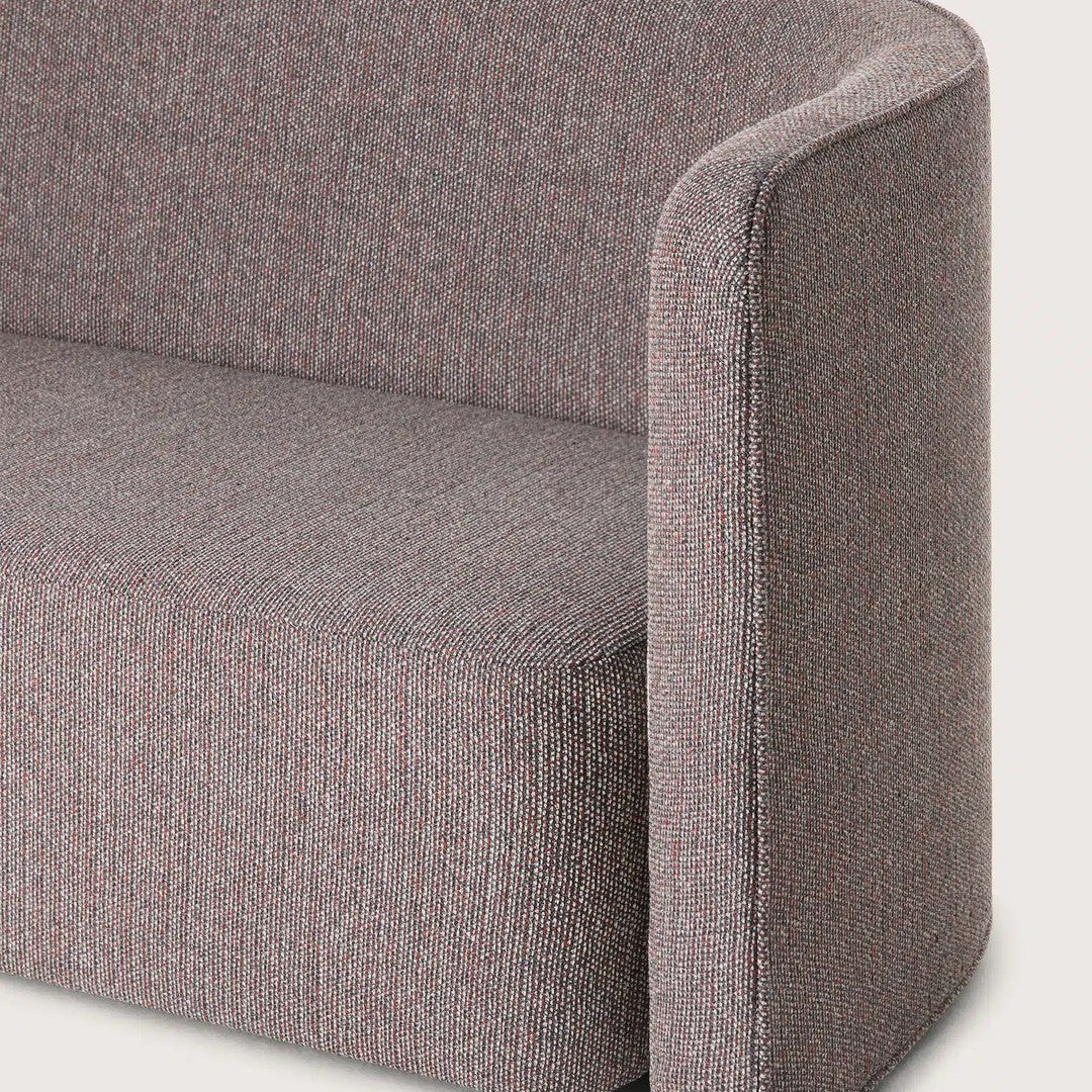 Textured gray fabric with subtle hints of pink, creating a modern and cozy look for stylish furniture.