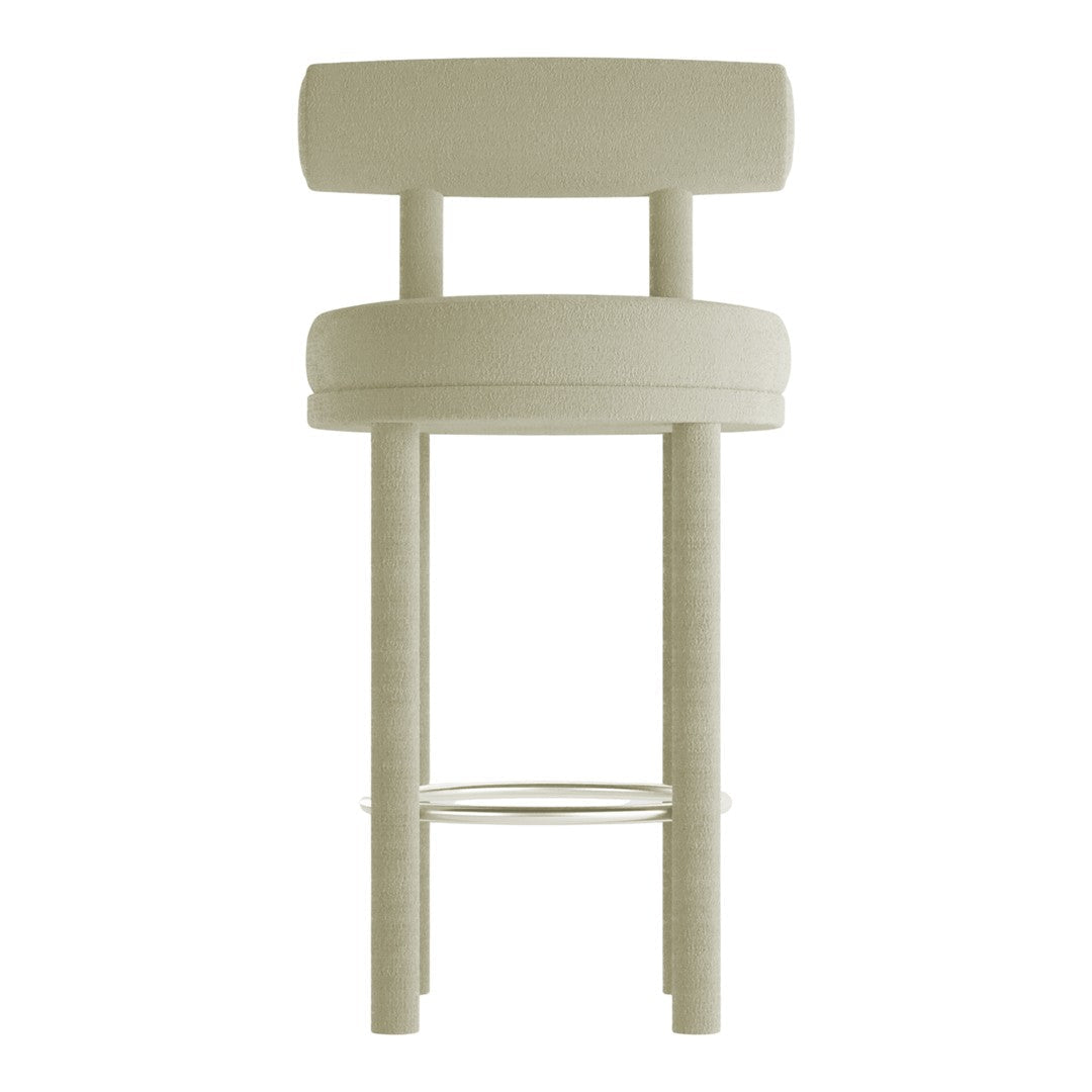 Light beige upholstered bar stool with a simple, modern design and circular patterns.