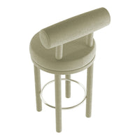 Light beige upholstered bar stool with a round seat and circular footrest, featuring a minimalist design.